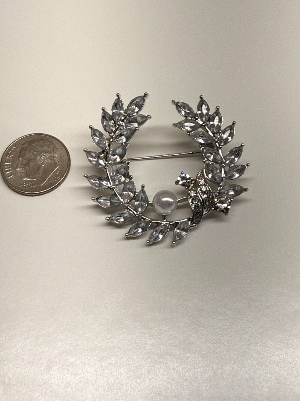 Rhinestone Laurel Wreath Brooch with Pearl Accent. measures 1.5" x 1.5"